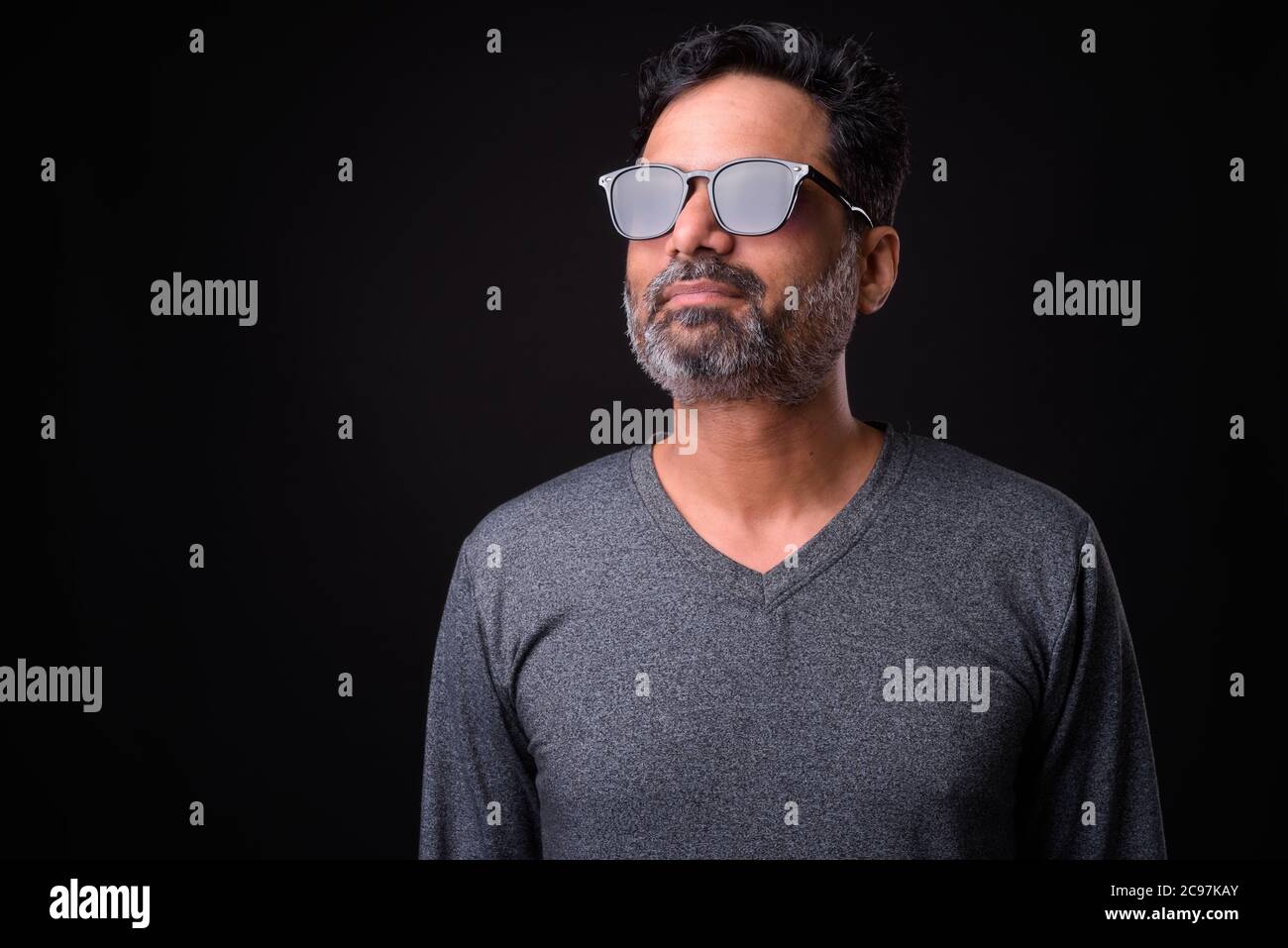 Portrait of mature bearded Indian man with curly hair Stock Photo - Alamy
