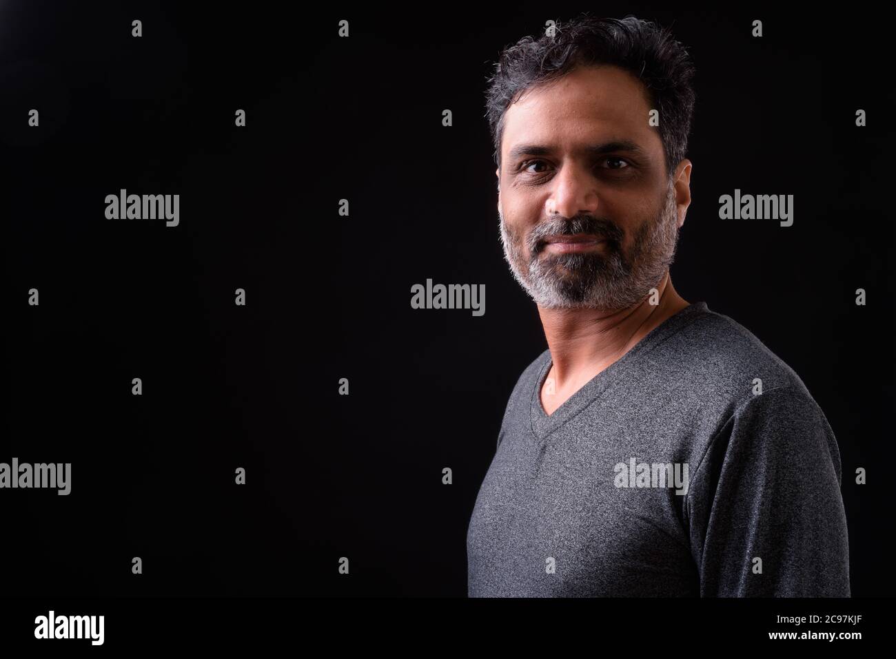 Portrait of mature bearded Indian man with curly hair Stock Photo - Alamy