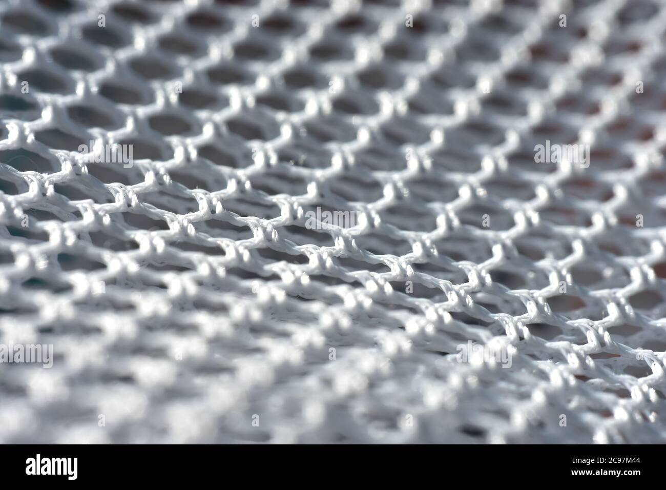 A simple white texture pattern of hexagons as a background Stock Photo