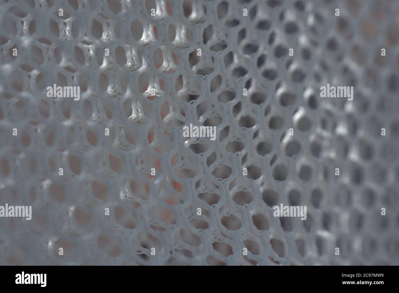 A simple white texture pattern of hexagons as a background Stock Photo