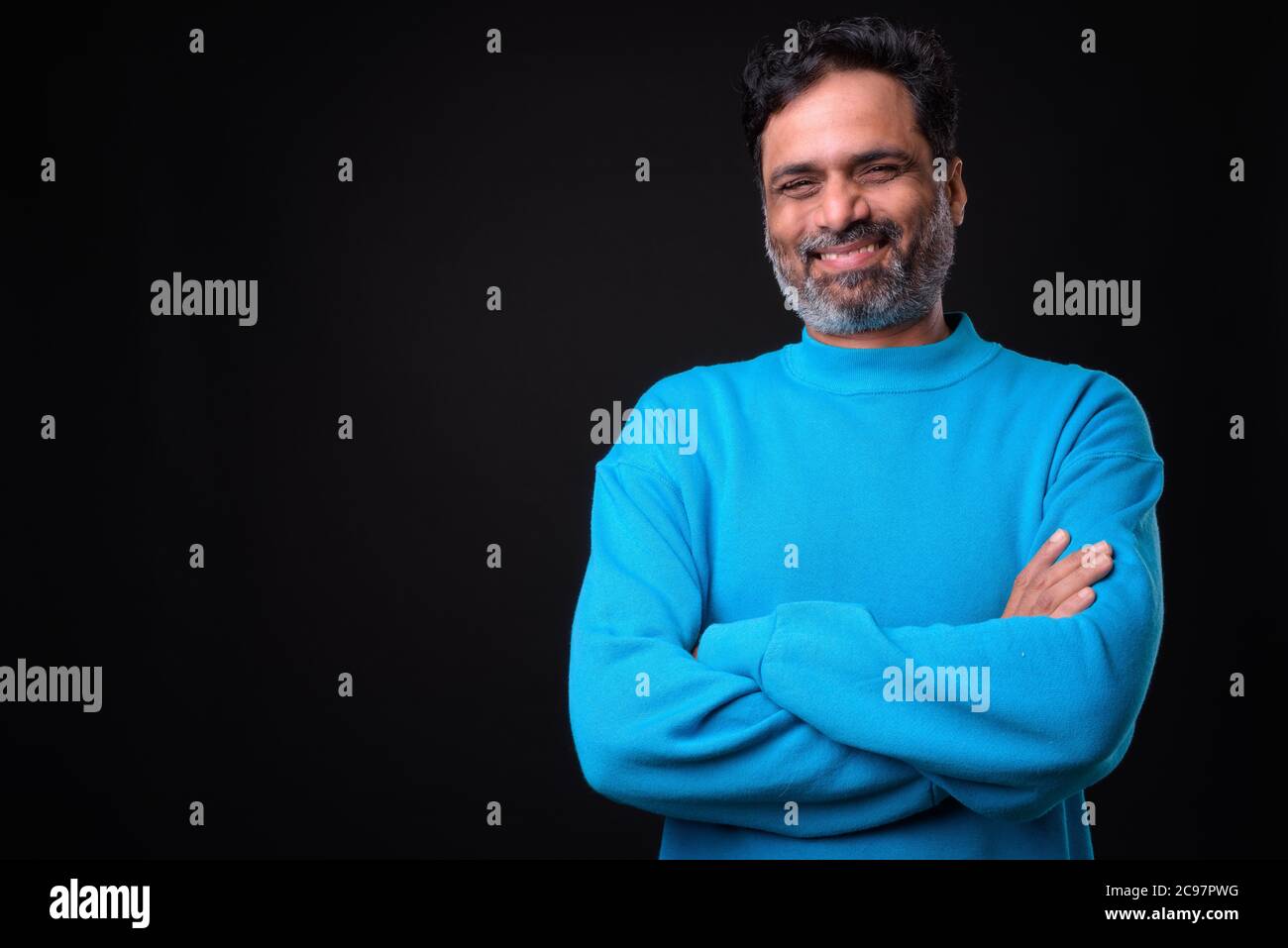 Portrait of mature bearded Indian man with curly hair Stock Photo - Alamy