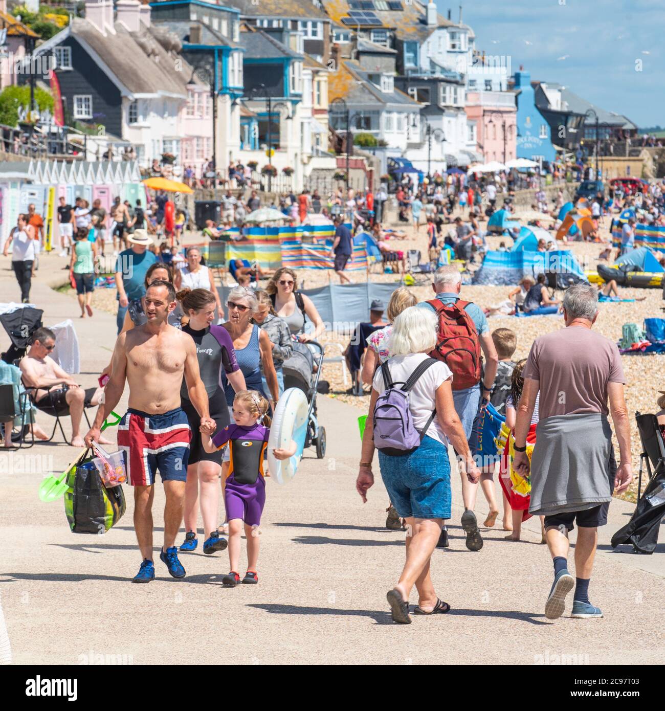 Lyme Regis, Dorset, UK. 29th July, 2020. UK Weather: The beach at the seaside resort of Lyme Regis was packed with sunseekers and families soaking up the scorching hot sunshine this afternoon. Credit: Celia McMahon/Alamy Live News Stock Photo