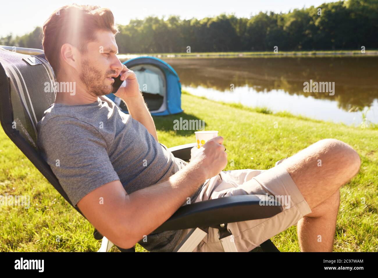 Man relaxing on camping in the summer Stock Photo