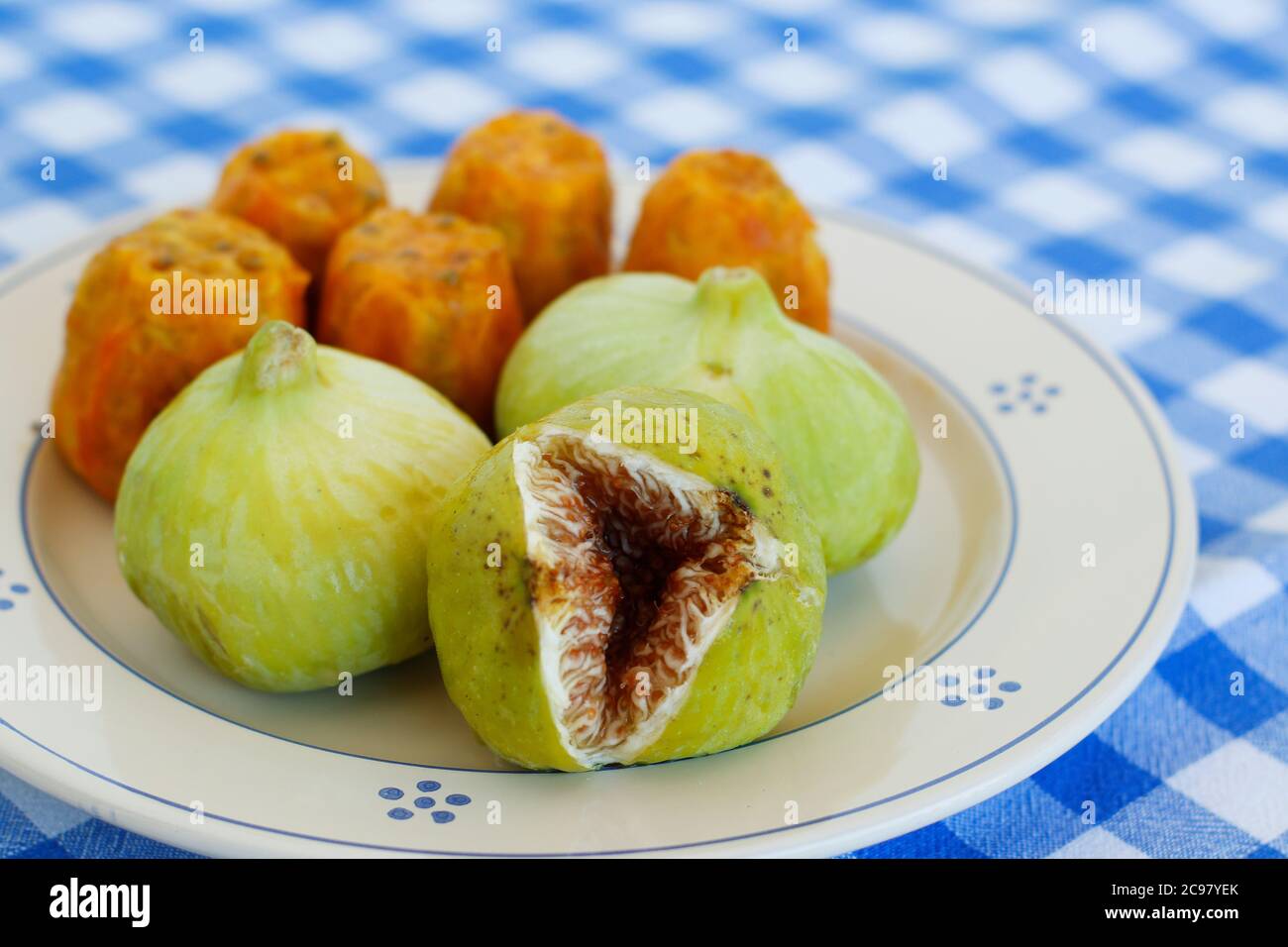 Breakfast in Salento, with typical products of the southern Italian tradition: Prickly pears, figs and Pasticciotto with cream on ceramic plates and w Stock Photo
