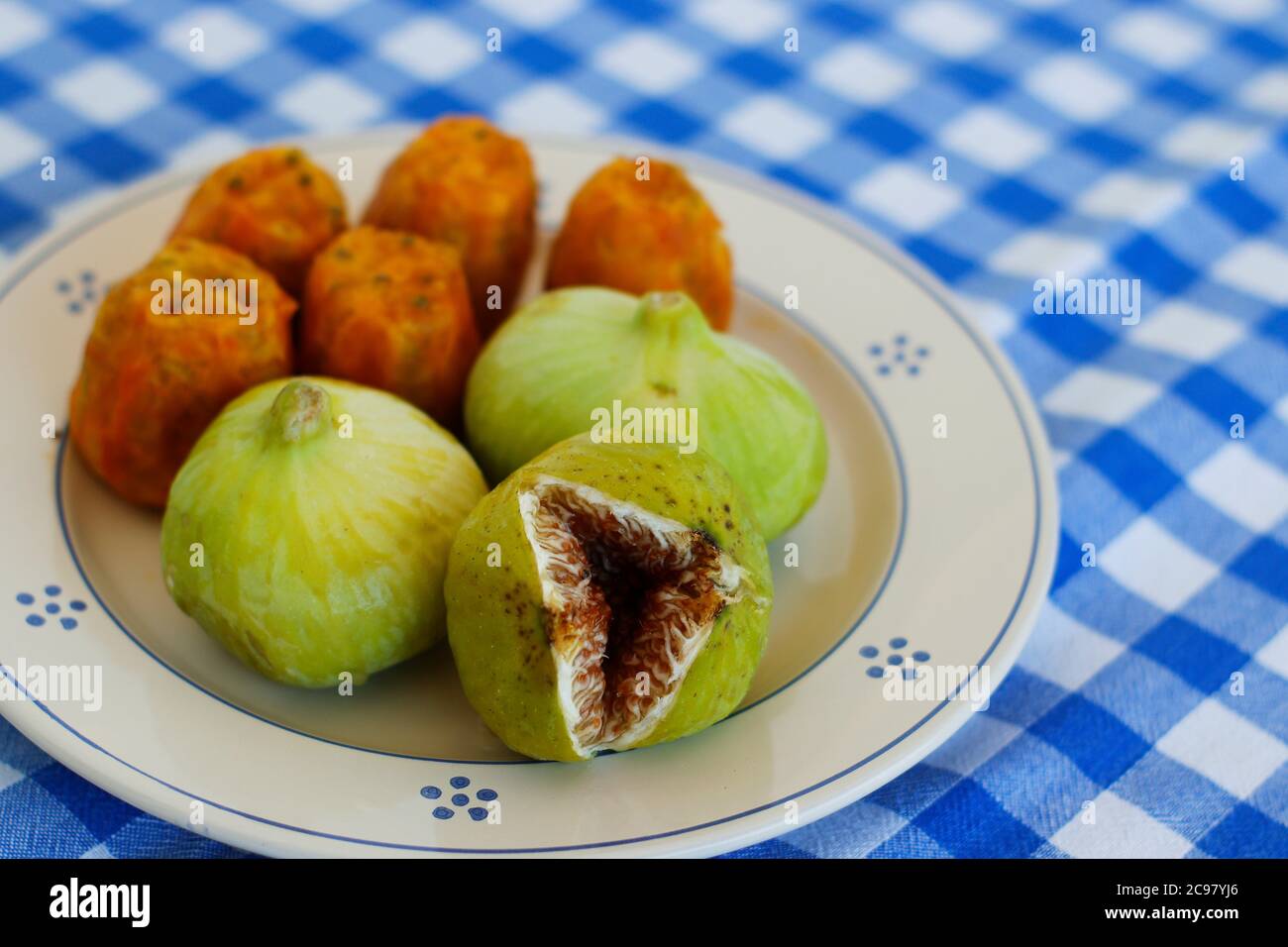 Breakfast in Salento, with typical products of the southern Italian tradition: Prickly pears, figs and Pasticciotto with cream on ceramic plates and w Stock Photo