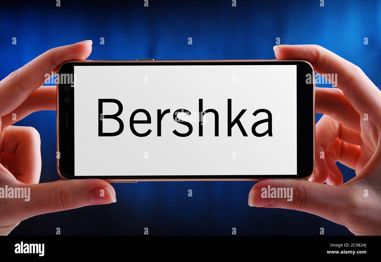 POZNAN, POL - JUN 12, 2020: Hands holding smartphone displaying logo of  Bershka, a clothing retailer company, it belongs to Spanish Inditex group  Stock Photo - Alamy