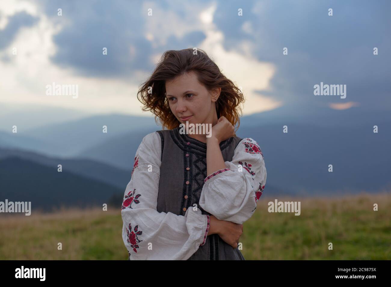 attractive girl in Ukrainian embroidery high in the carpathian mountains Stock Photo
