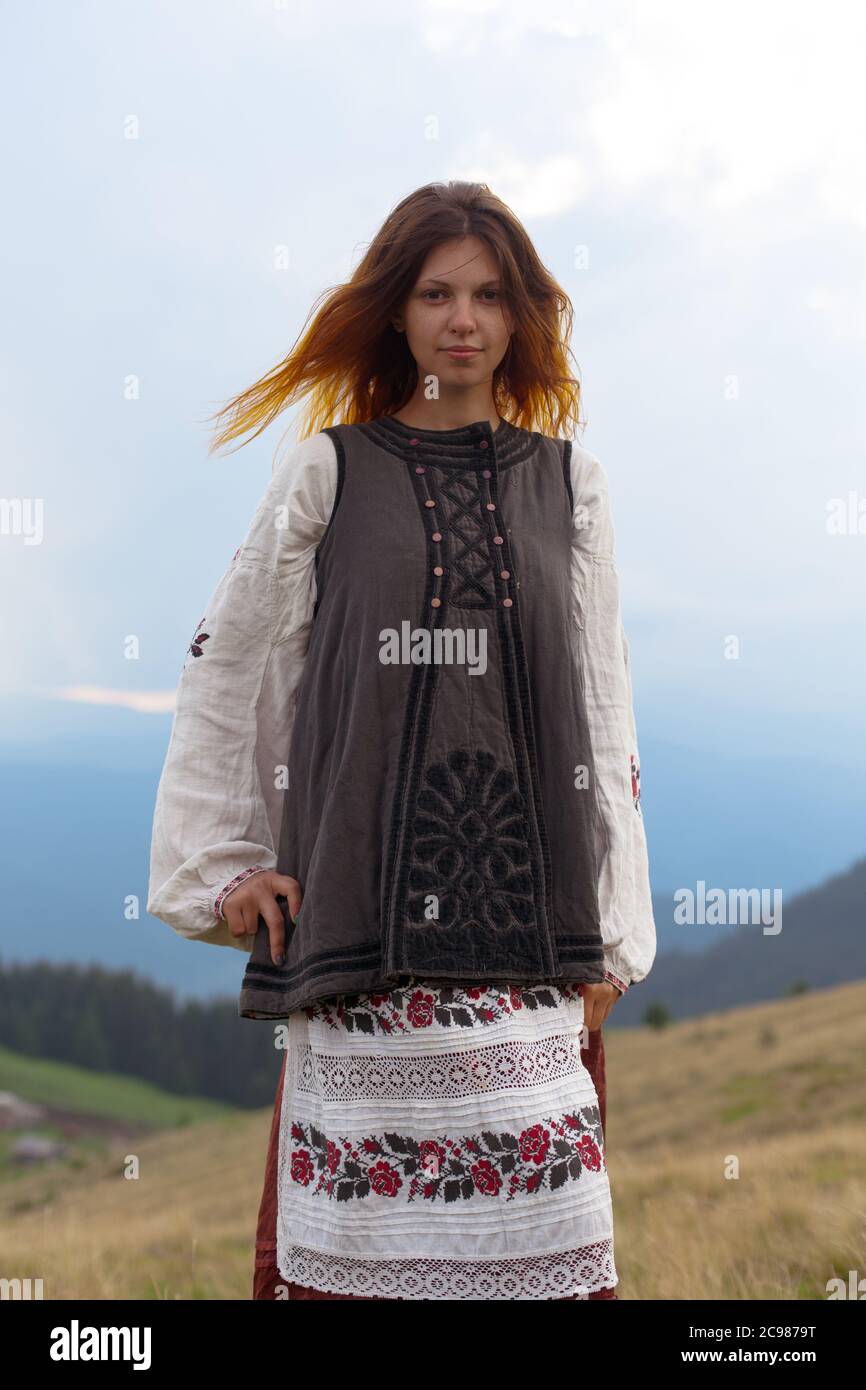attractive girl in Ukrainian embroidery high in the carpathian mountains Stock Photo