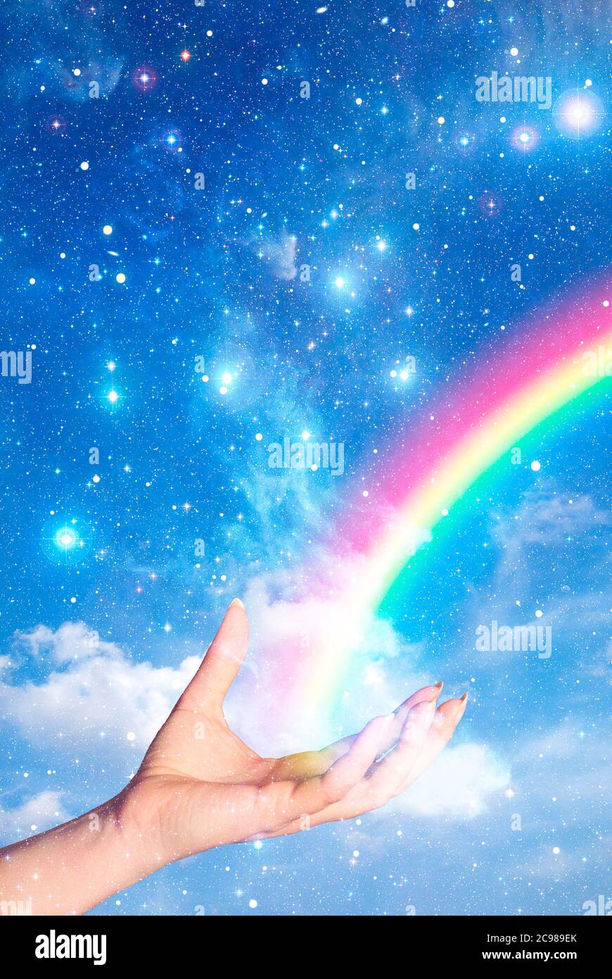 open hand and a rainbow starting from it Stock Photo