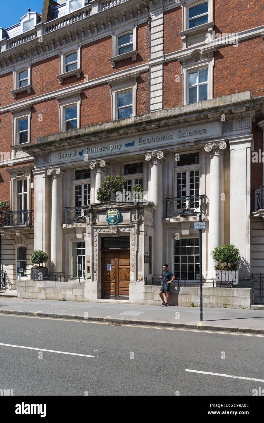 A solitary man stands outside the School of Philosophy and Economic ...