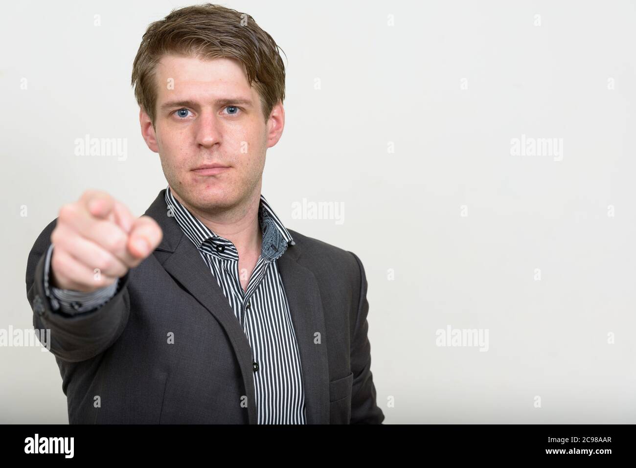 Portrait of young handsome businessman in suit Stock Photo - Alamy
