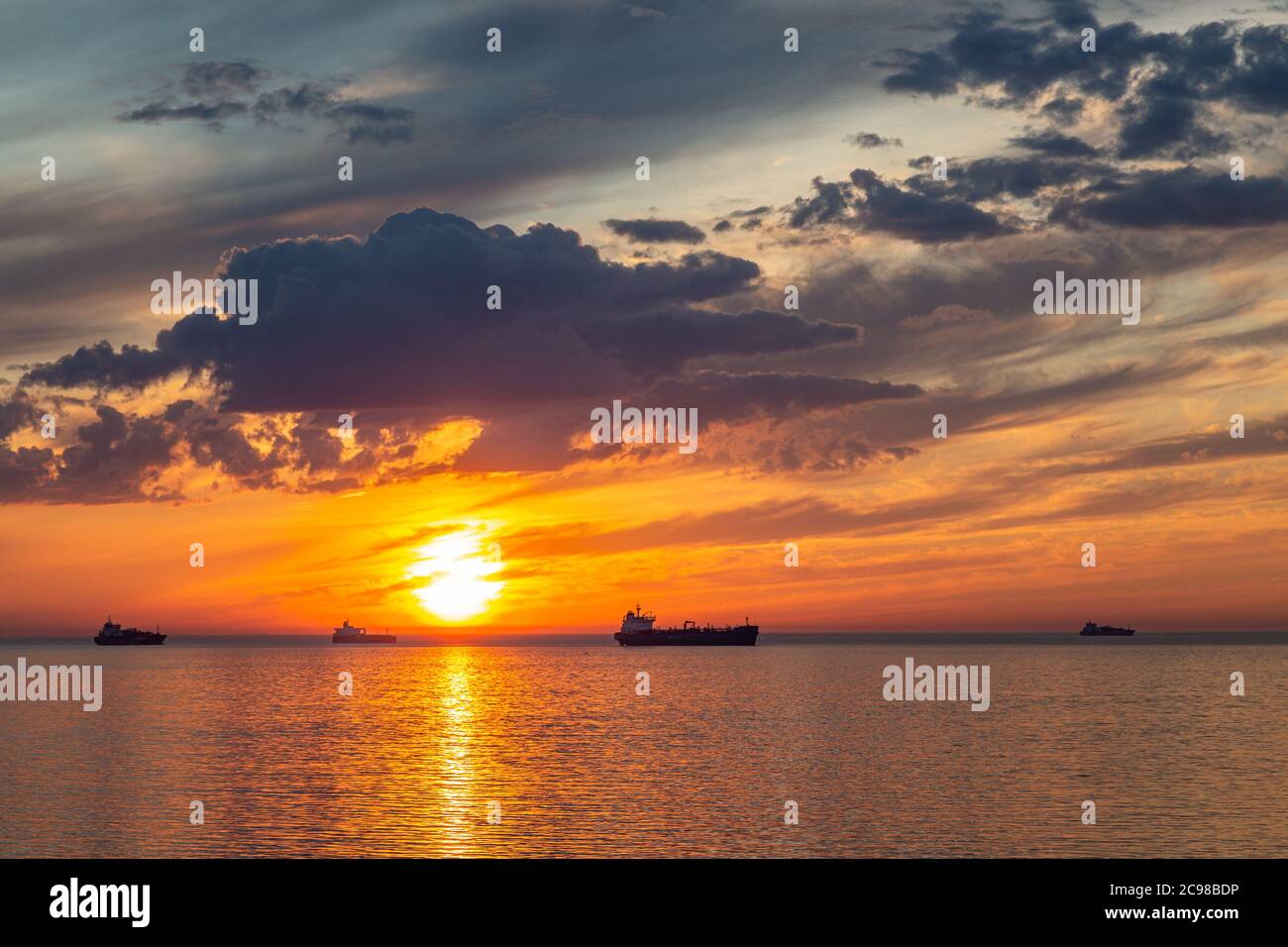 Beautiful sunset on sea ships hi-res stock photography and images - Alamy