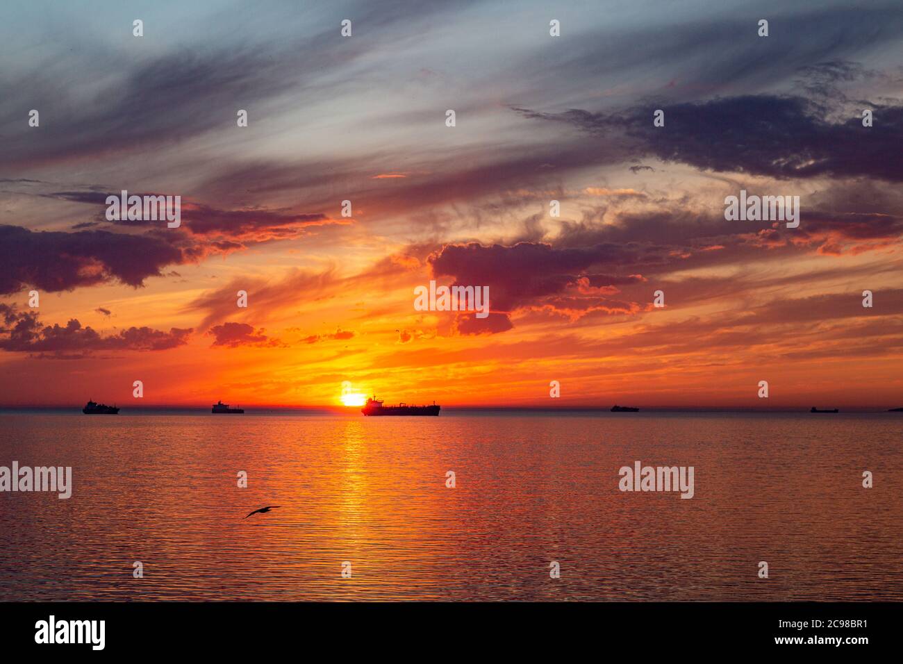 Beautiful sunset on sea ships hi-res stock photography and images - Alamy