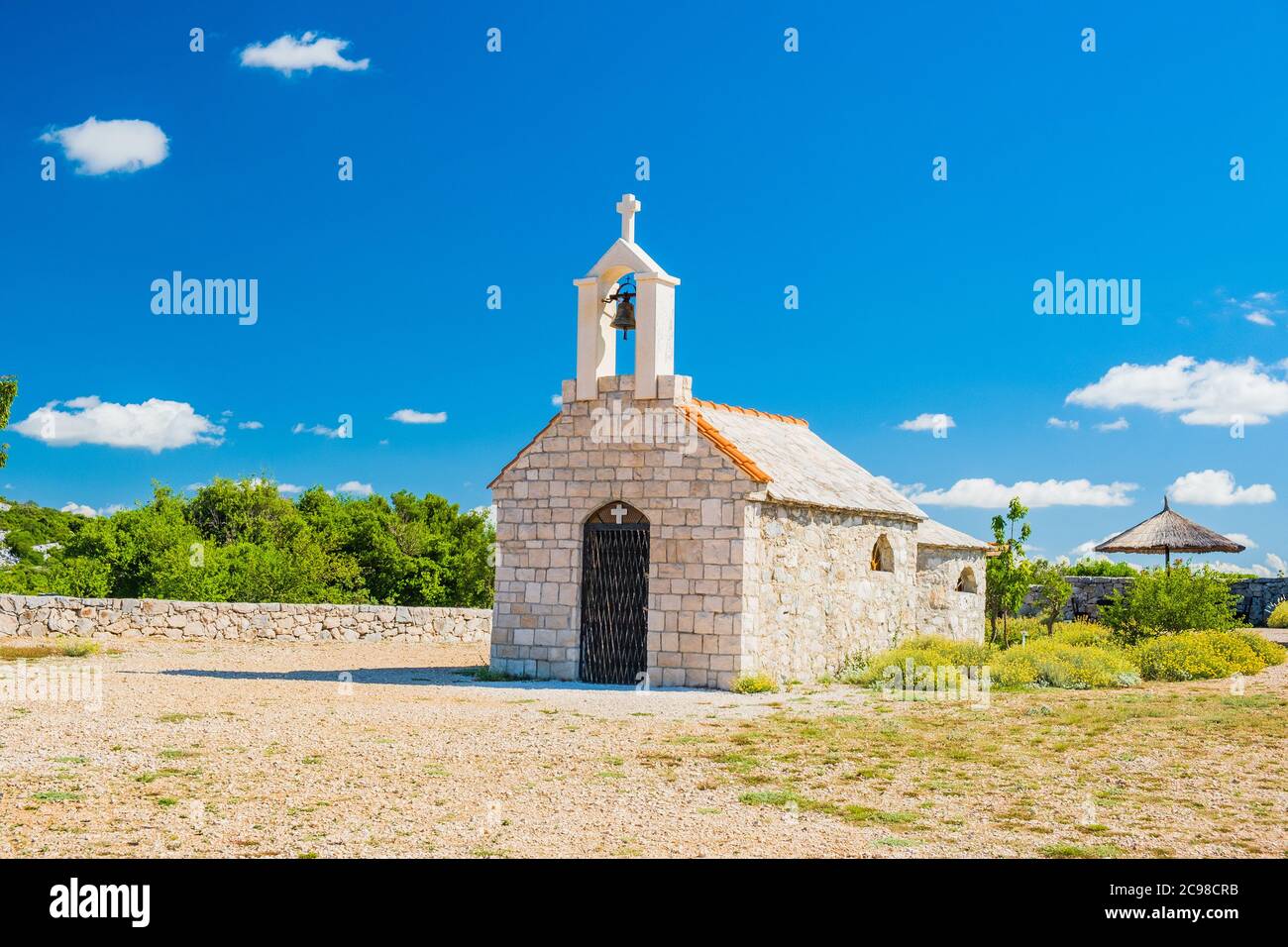 Croatia, mount Kamenjak on Vransko lake, beautiful old stone church on the hill, Mediterranean landscape Stock Photo