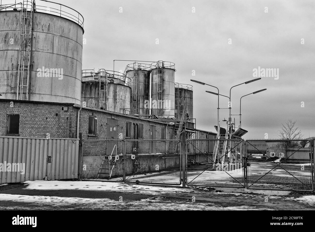 Black and white shot of old oil tanks Stock Photo Alamy