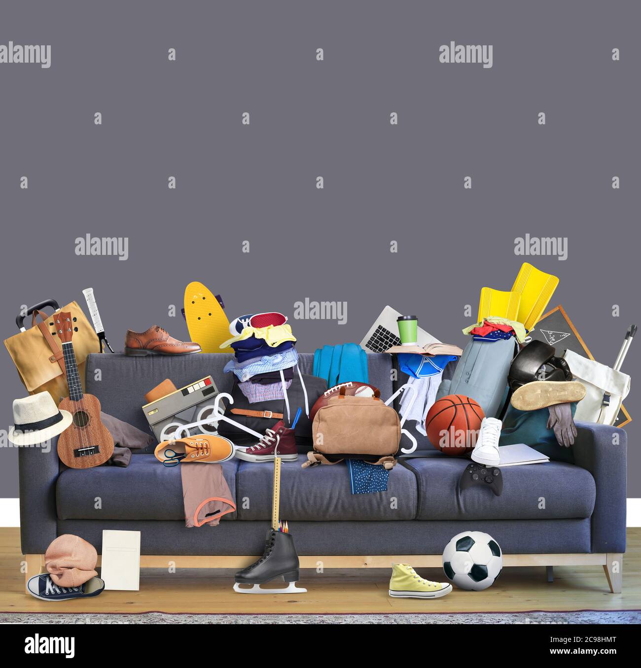 Large leather sofa with a bunch of different things Stock Photo - Alamy