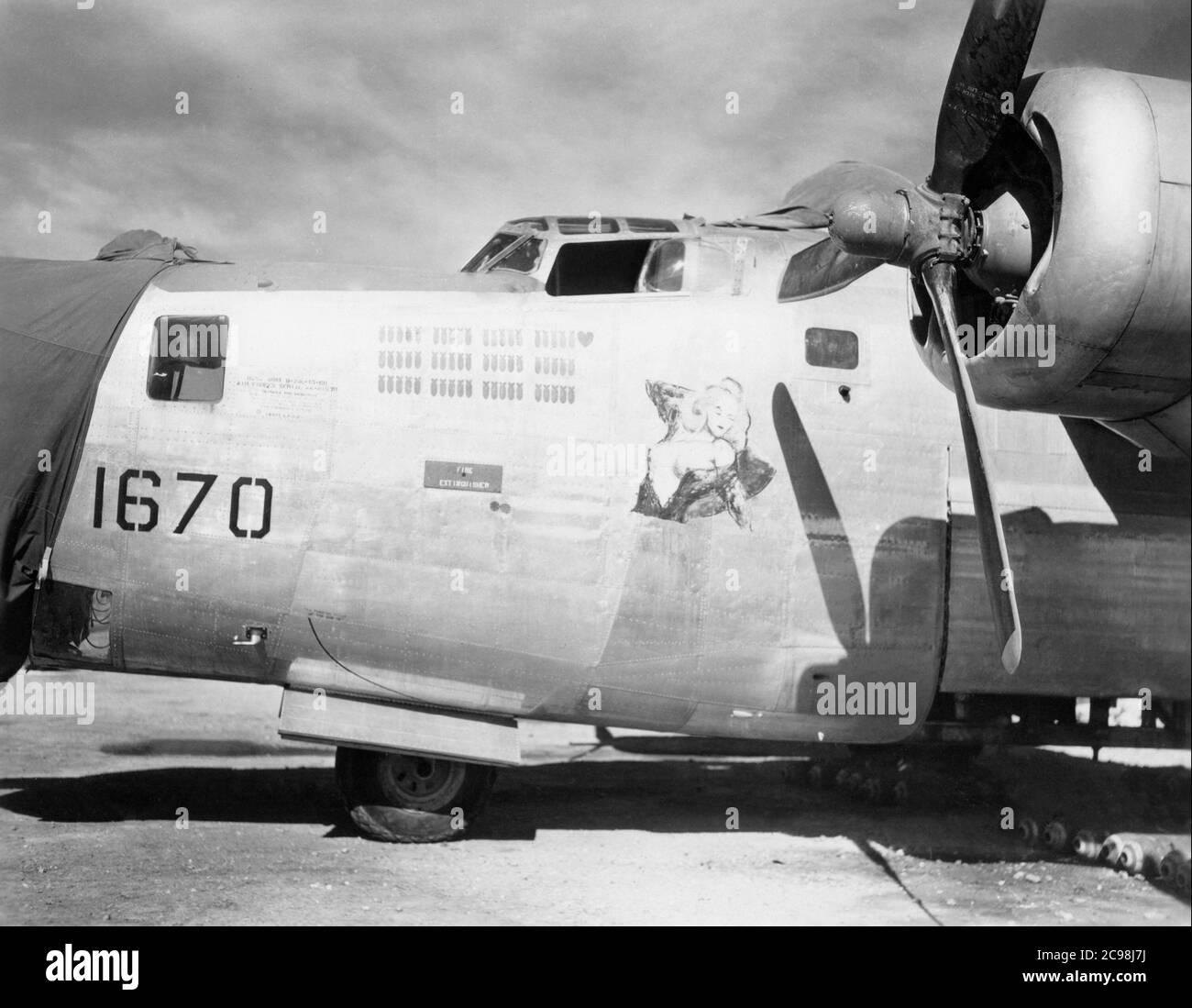 Consolidated B-24 Liberator number 1670 between missions on Guam, July, 1945. As the 75th anniversary of V-J Day approaches, The Consoli Collection has published four photo essays by U.S. Navy Lt. (j.g.) Joseph J. Consoli. The photos were taken between July and December 1945 in the Mariana Islands. They document U.S. Navy life before and after the Japanese surrender. Stock Photo