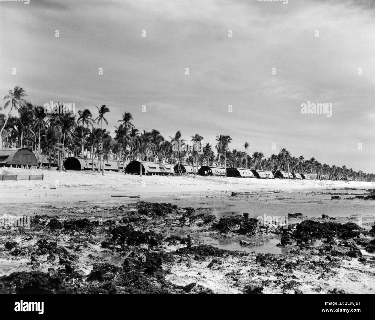 Quonset huts on the beach. Camp Dealey Submarine Recuperation Camp. Guam, July 1945. As the 75th anniversary of V-J Day approaches, The Consoli Collection has published four photo essays by U.S. Navy Lt. (j.g.) Joseph J. Consoli. The photos were taken between July and December 1945 in the Mariana Islands. They document U.S. Navy life before and after the Japanese surrender. Stock Photo