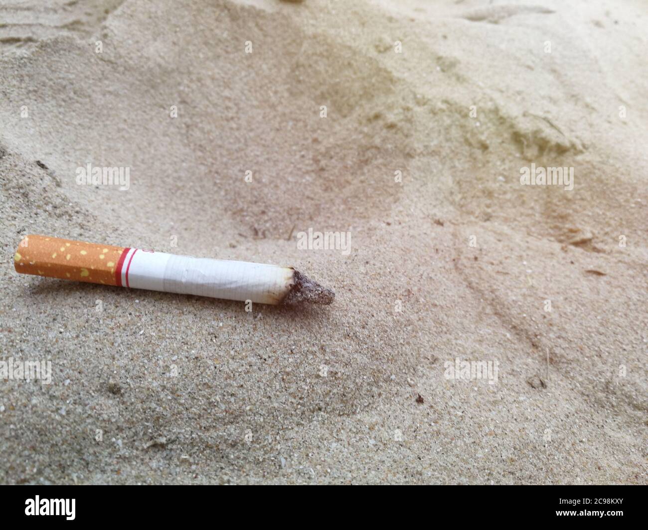 cigarette on beach Stock Photo