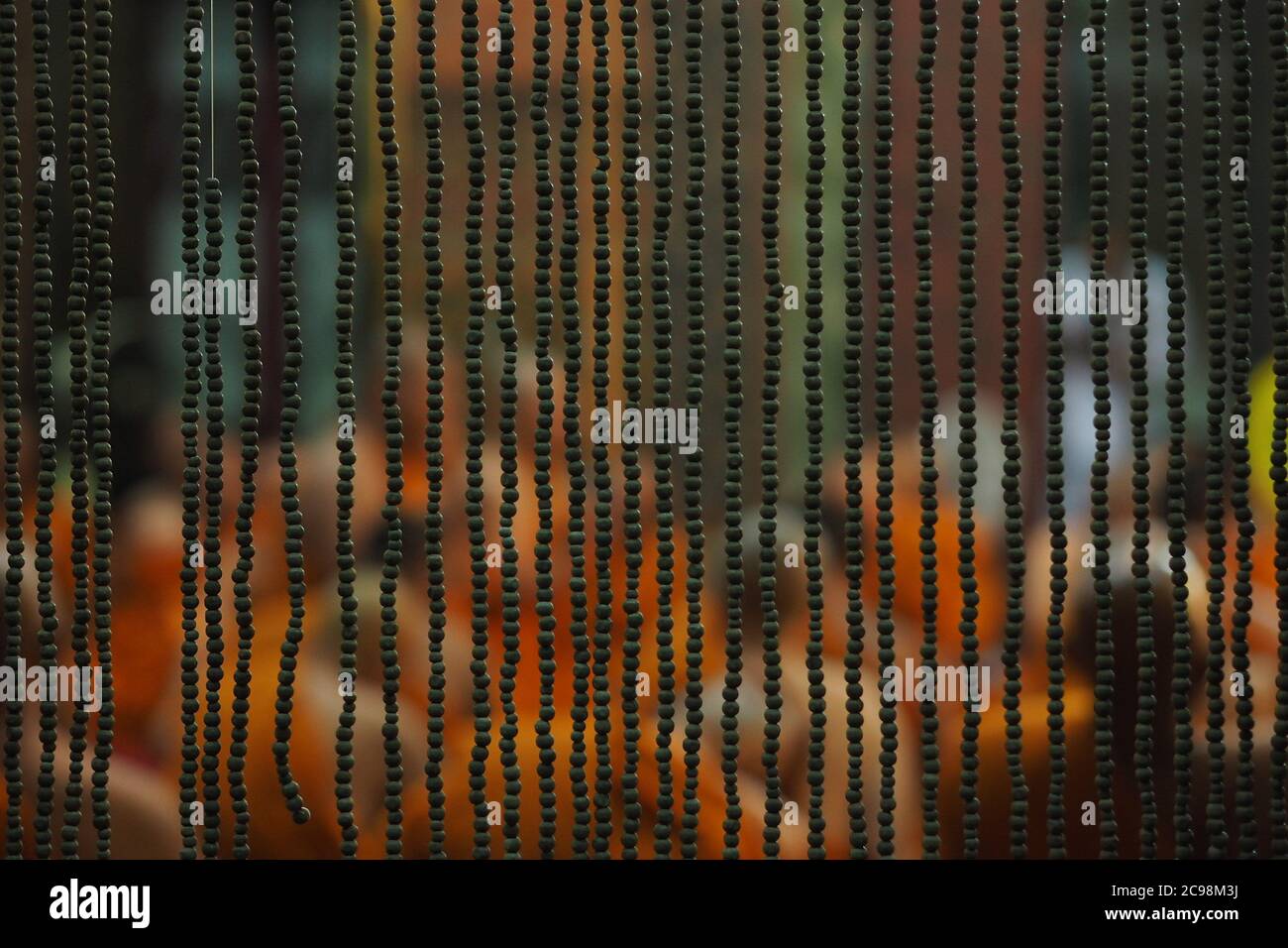 Look at the monks through the blinds in Thailand temple Stock Photo