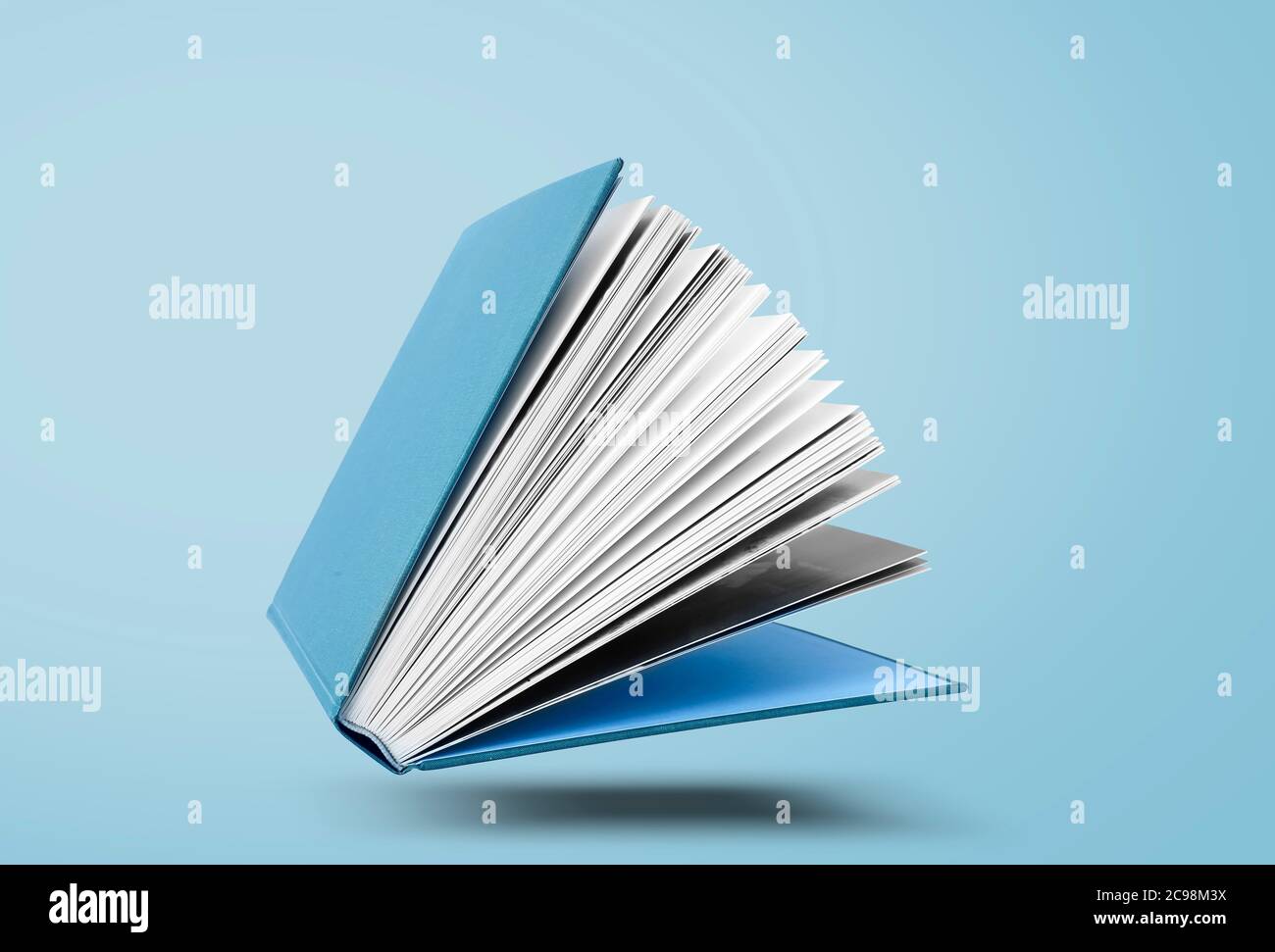 Large hardcover book with open pages Stock Photo Alamy