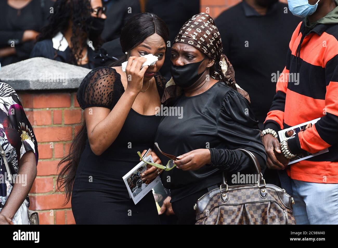 Khaji Kareem (left), the sister of Alexander Kareem, after his funeral service at the Church of Holy Ghost and St Stephens in London. Stock Photo