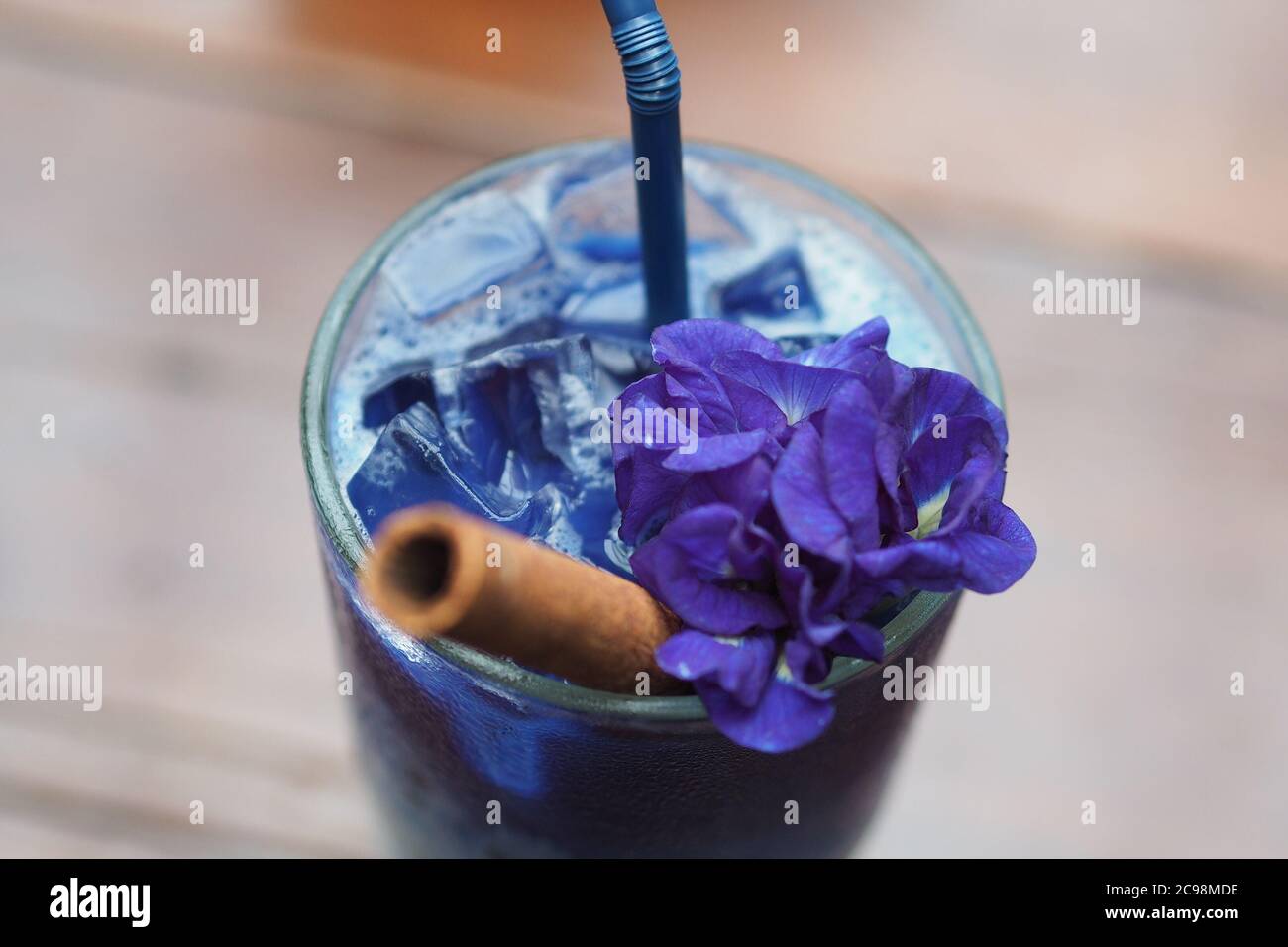 Butterfly Pea Tea with Cinnamon roll Stock Photo