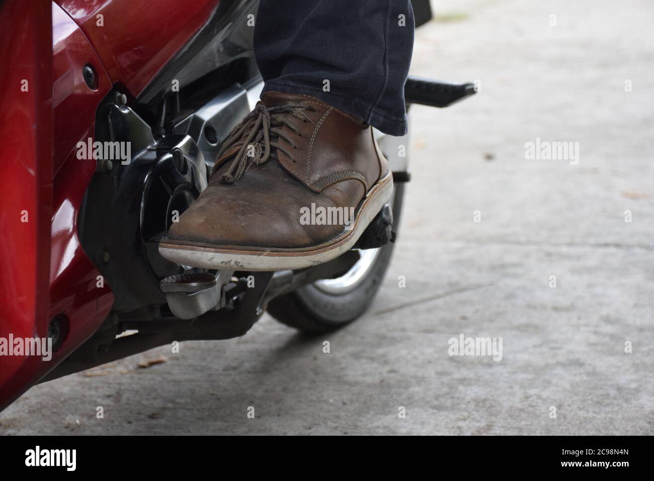 Shift Into First Gear and Upshift into higher gears. on a Motorcycle Stock Photo