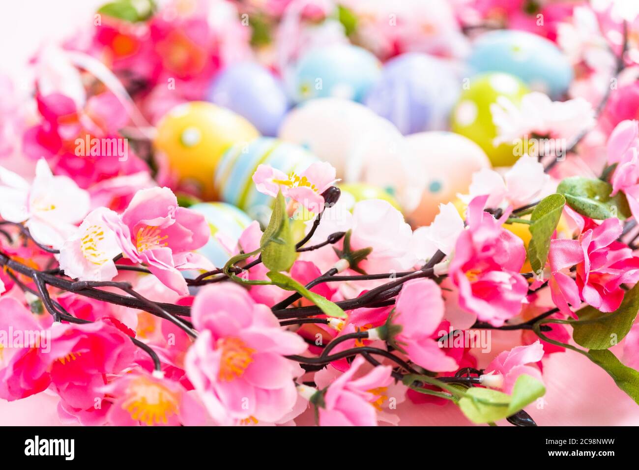 Easter eggs and pink flowers on a pink backgorund Stock Photo - Alamy