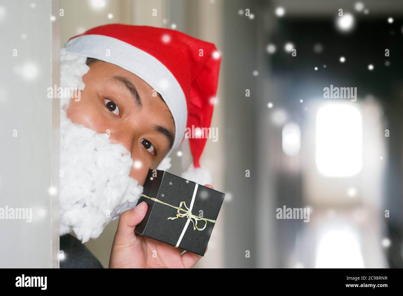 Men Xmas Christmas Cosplay Santa for surprise with mini gift box in Christmas Day. Stock Photo