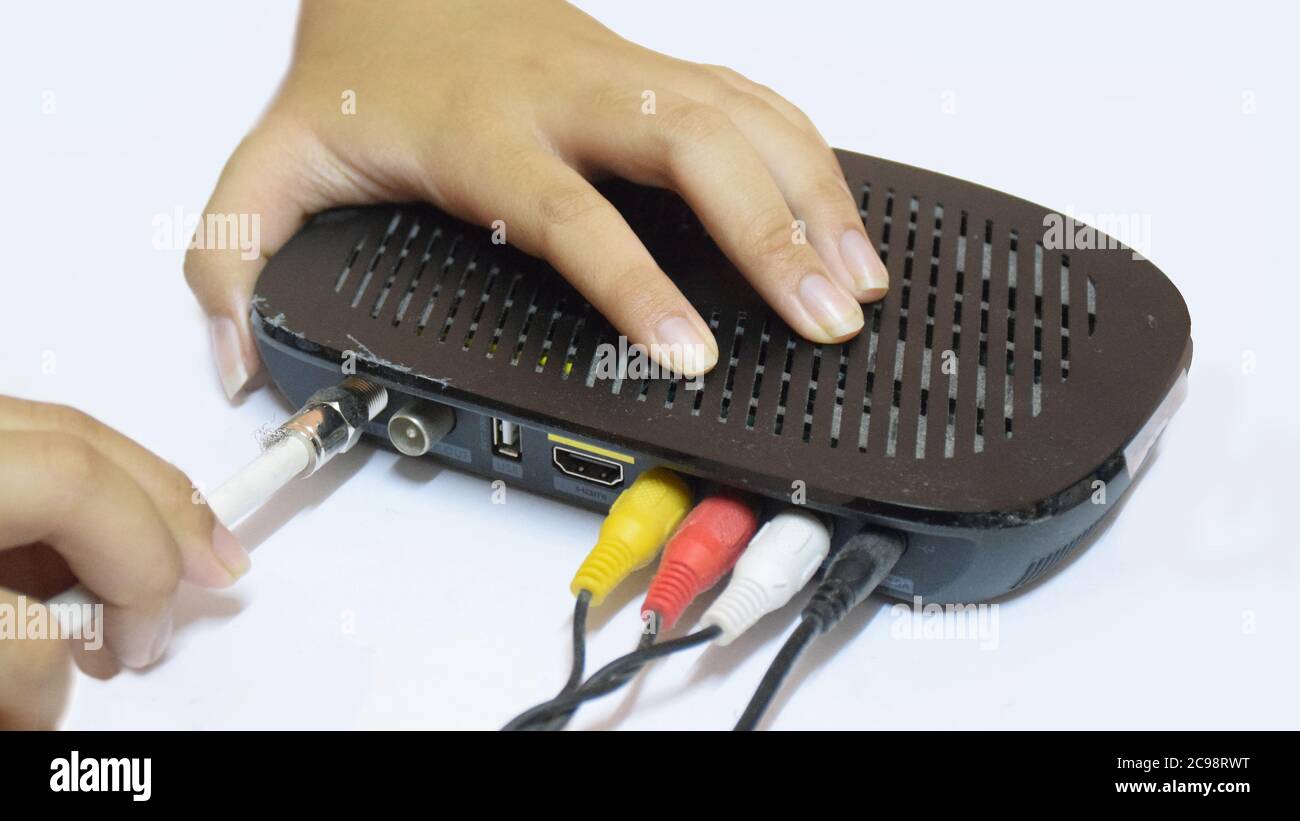 Coaxial cable connect to Cable TV box. Stock Photo