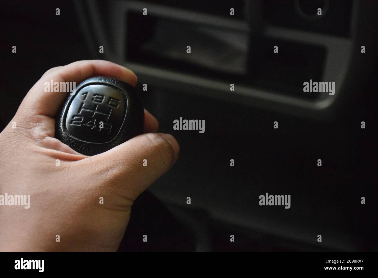 Driver controlling a Manual transmission or manual gearbox. Stock Photo