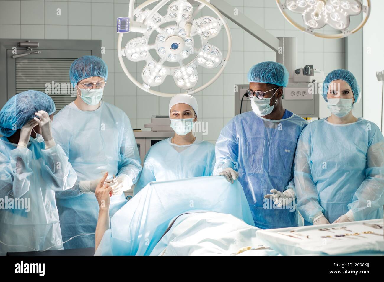 patient lying on the bed has conscious after anesthesia in the