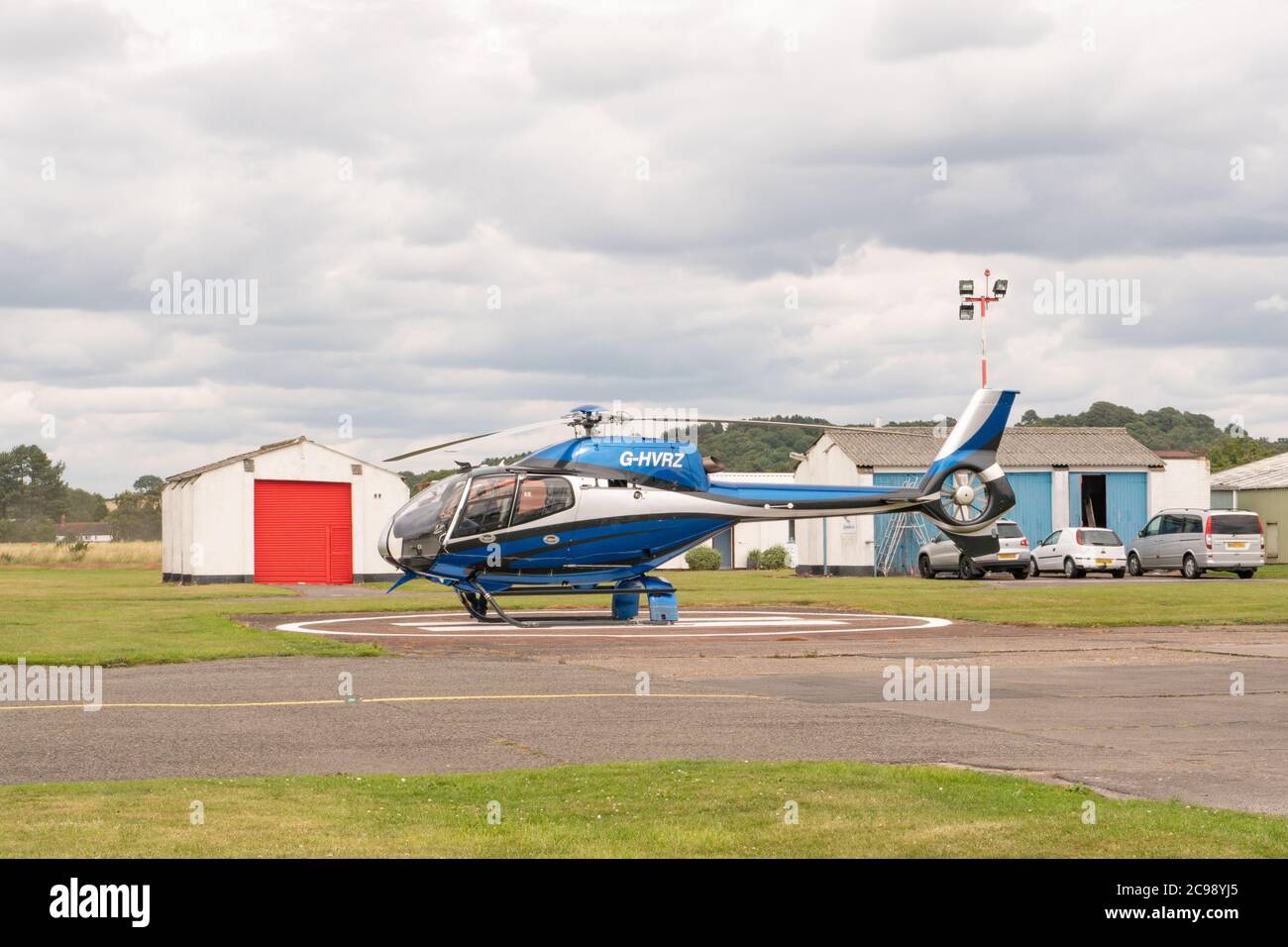 Helicopter parked on landing pad at Wolverhampton Halfpenny Green Airfield. Staffordshire. UK Stock Photo