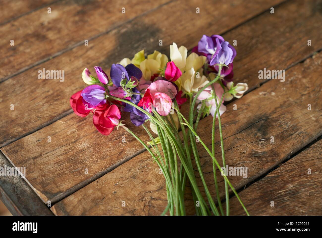 Flowers arranged on a table at Wedding lunch. Stock Photo