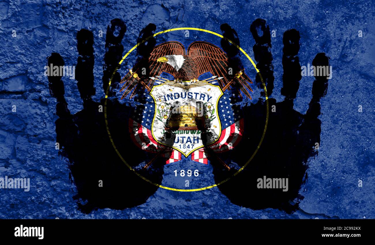 Handprints on the background of the flag of State of Utah. Freedom of