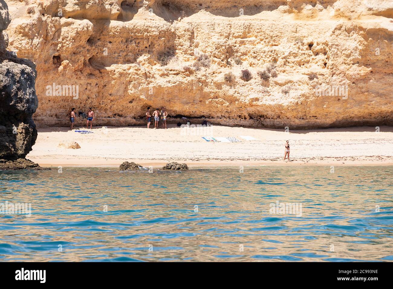 Lagoa, Portugal - July 11, 2020: Beach hidden in a cliff in Carvoeiro, Algarve, Portugal Stock Photo