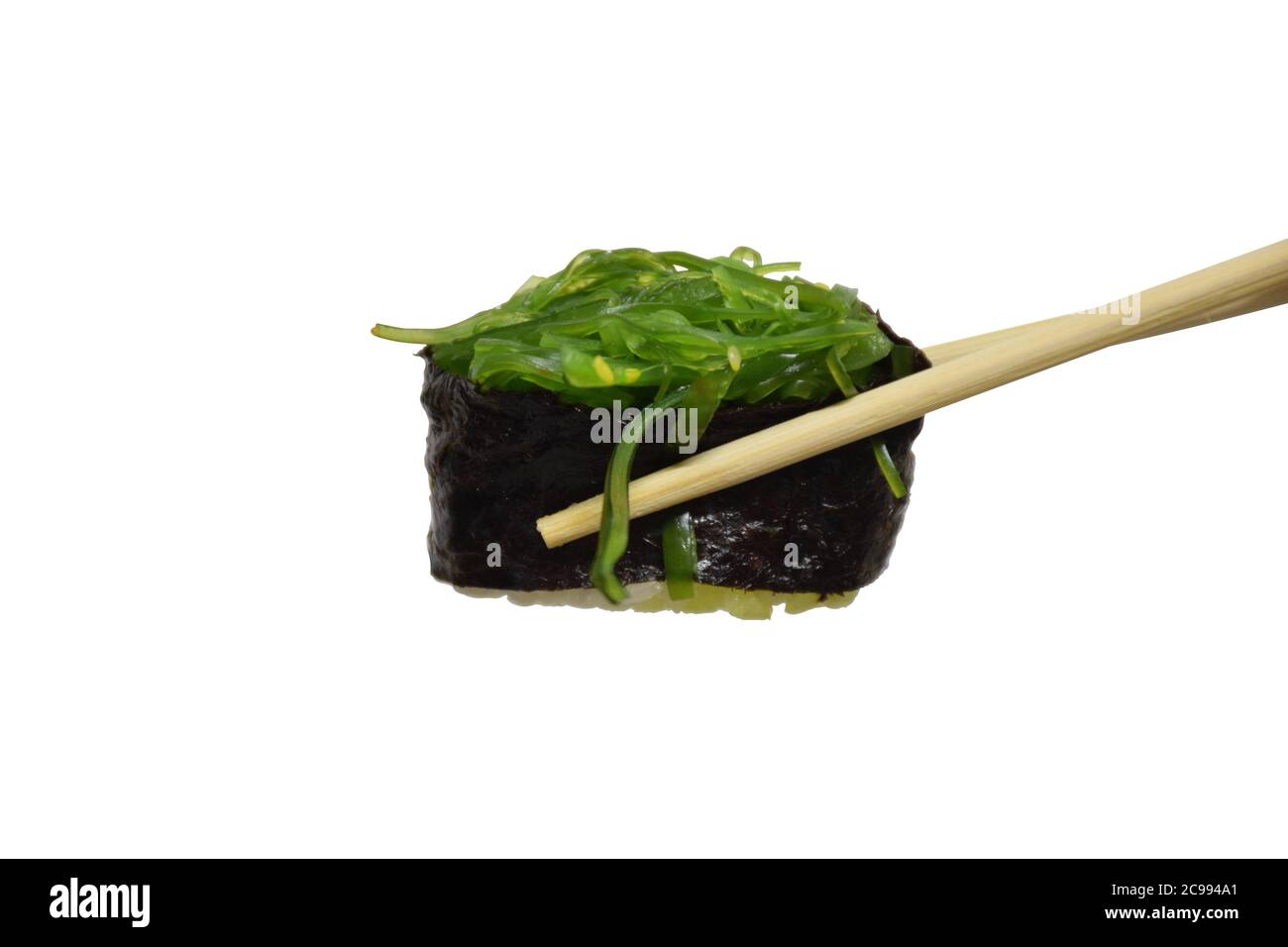 Edible seaweed or sea vegetables on wooden chopsticks isolated on white background with clipping path Stock Photo