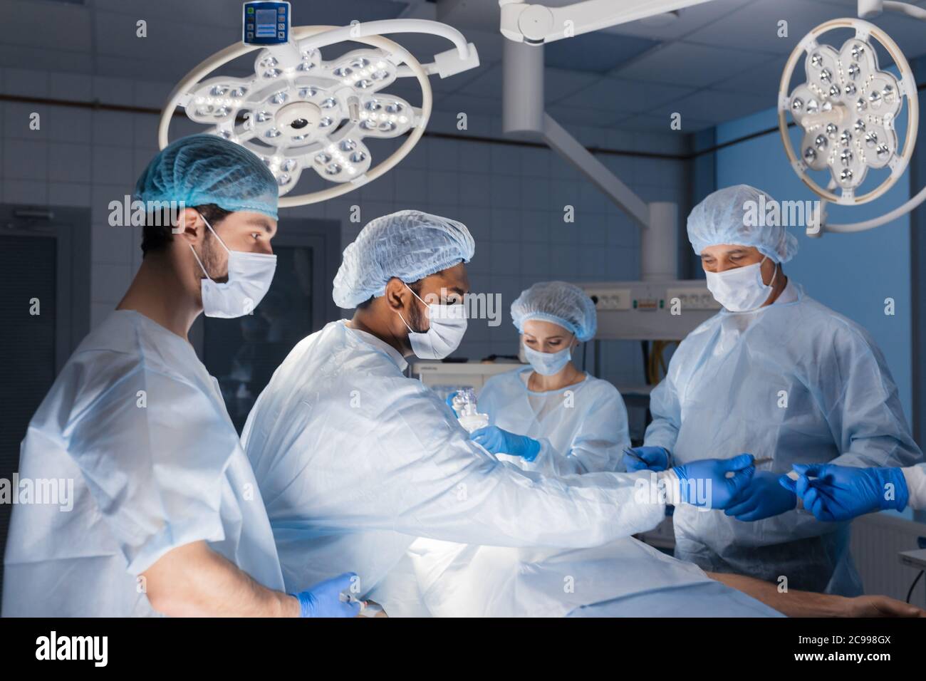 Surgery time at Clinical Hospital. Team of surgeons at work. Complex