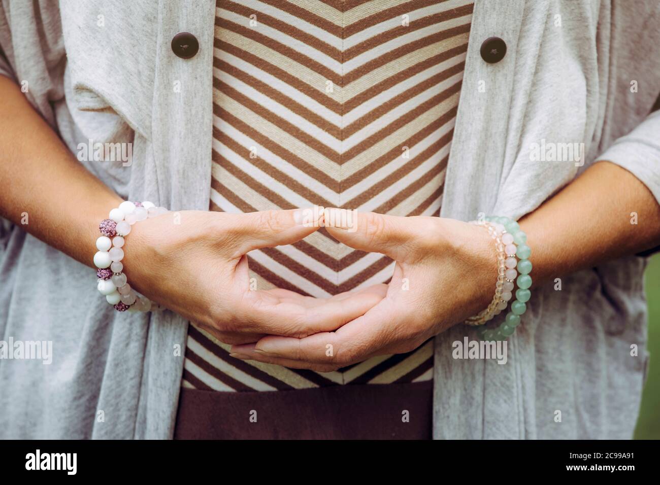 Close up view of woman hands doing meditation Dhyana mudra gesture also known as Samadhi mudra. Stock Photo