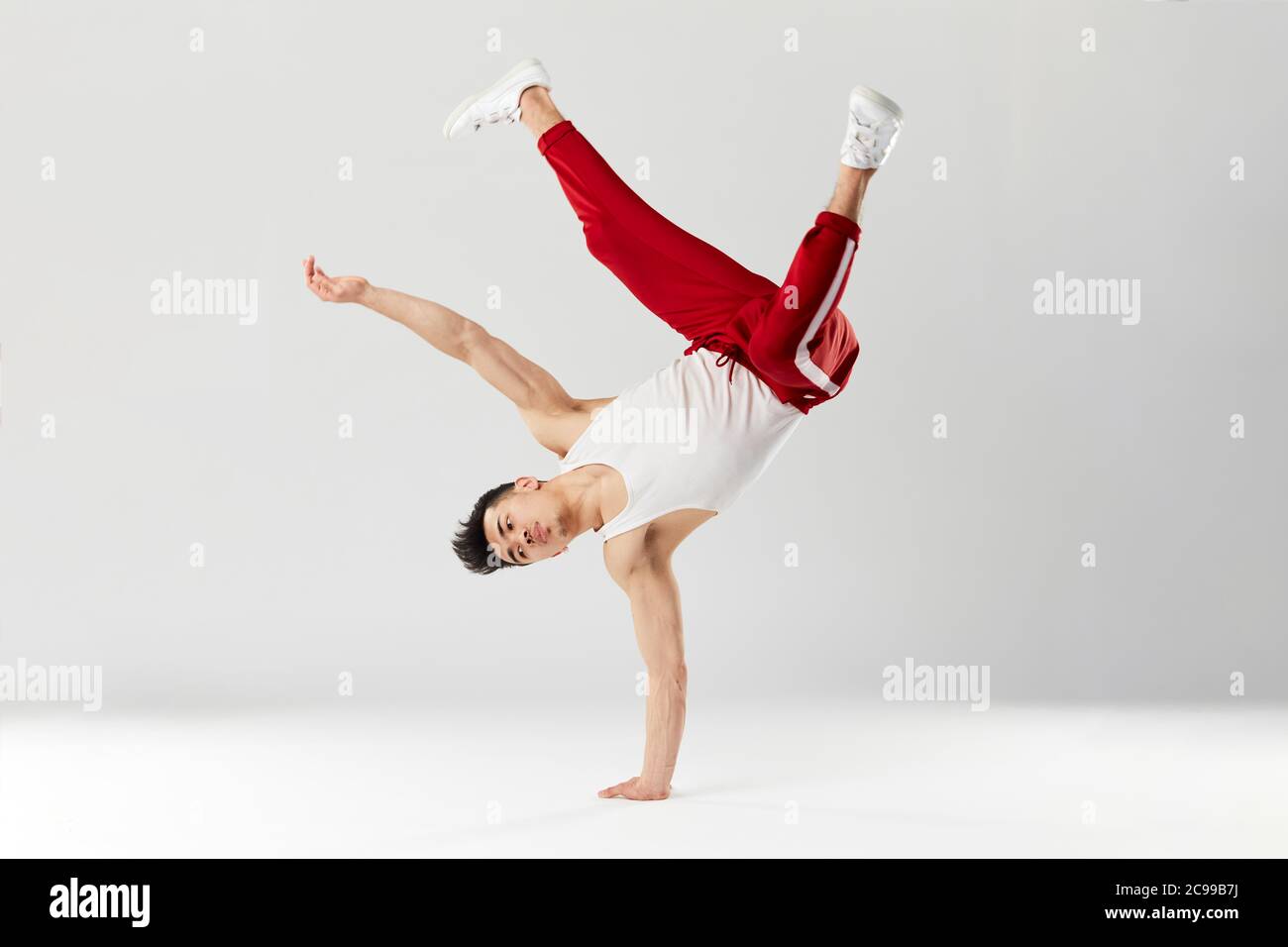 Athletic Young B Boy Standing On One Hand While Dancing Break Dance And Doing Downrock Isolated Over White Studio Background Stock Photo Alamy Athletic Young B Boy Standing On One Hand While Dancing Break Dance And Doing Downrock Isolated Over White Studio Background Stock Photo Alamy