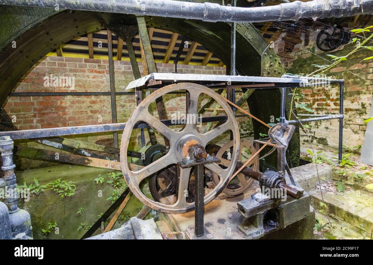The waterwheel and vintage machinery in the restored Lower Pump House in Stourton, a small village near Stourhead, Wiltshire, south-west England Stock Photo