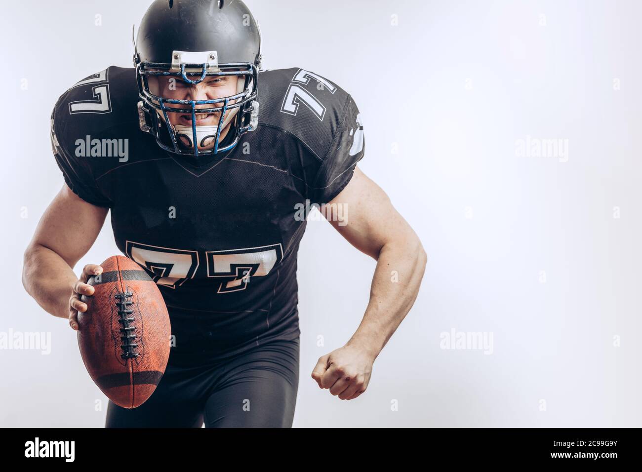 Isolated motion shot of American Football Quarterback player in