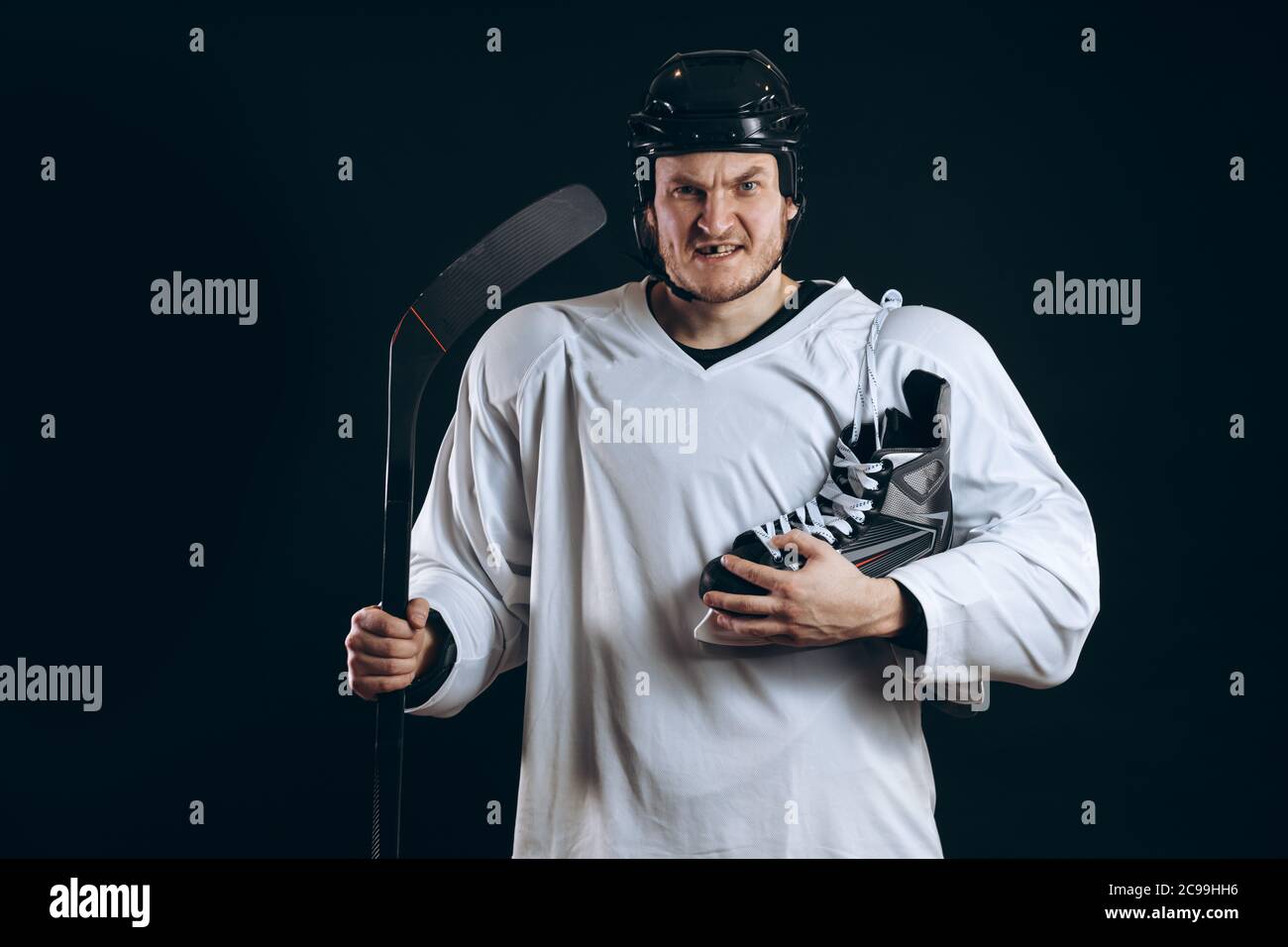 Portrait of a professional hockey player in a protective sportswear and