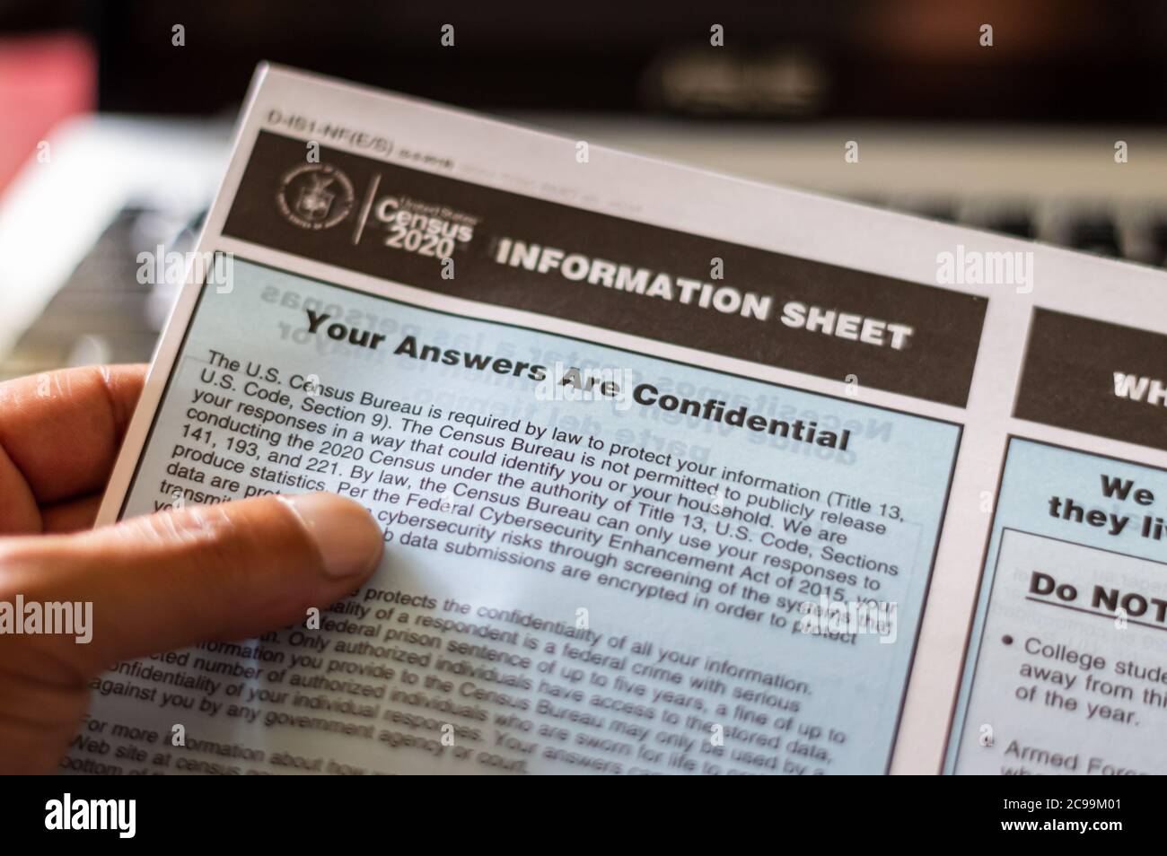 A hand holding an Information Sheet about Confidentiality from the US Census Bureau. Chicago, Illinois-July 29, 2020 Stock Photo