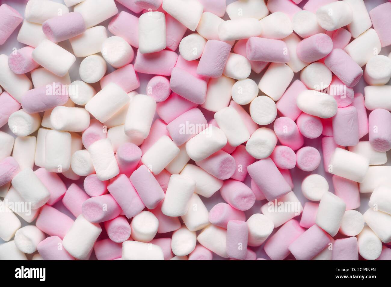 Pink and white marshmallows in close up. Soft candy background. Stock Photo