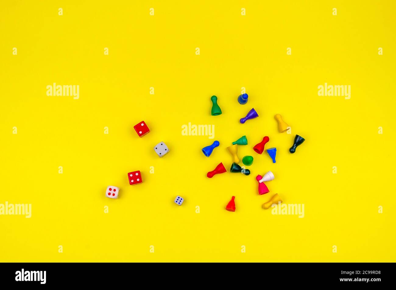 Dices and chips on a yellow background. Stock Photo
