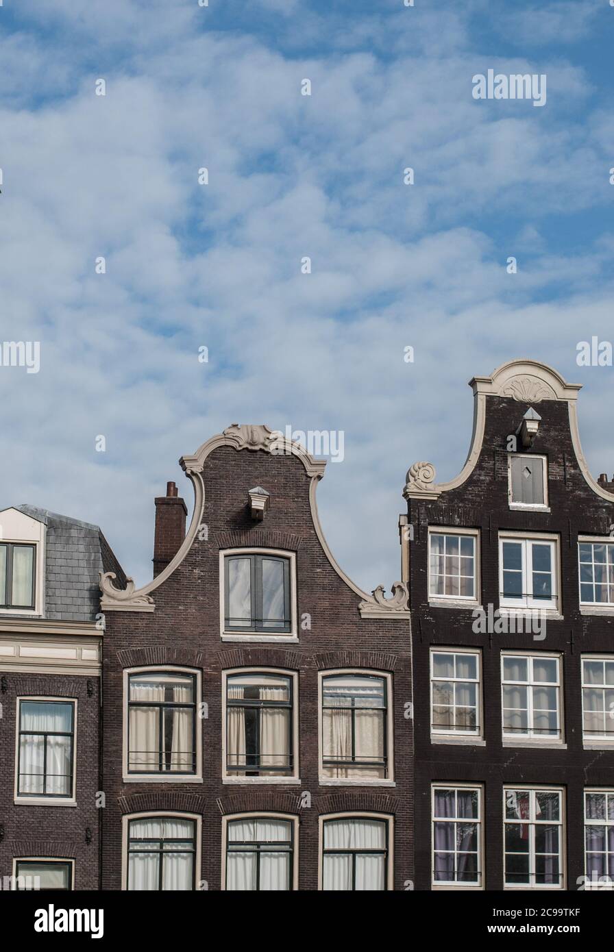 Traditional facades of ancient buildings in Amsterdam, Netherlands Stock Photo