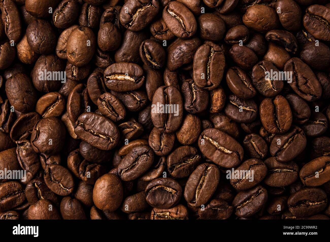 Roasted coffee beans on the table, macro Stock Photo - Alamy