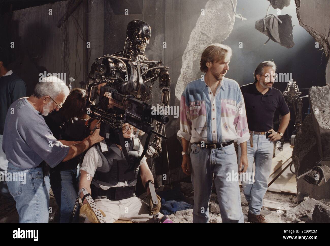 Orlando.Florida.USA. Director James Cameron (blue-red shirt) on a set in  Nevada to shoot 3D scenes for an attraction at ©Universal Studiios, T2-3D:  Battle Across Time (1996) (also known as Terminator 2: 3D)